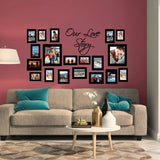 Stylish living room with wall art sticker "Our Love Story" and photo frames enhancing the decor