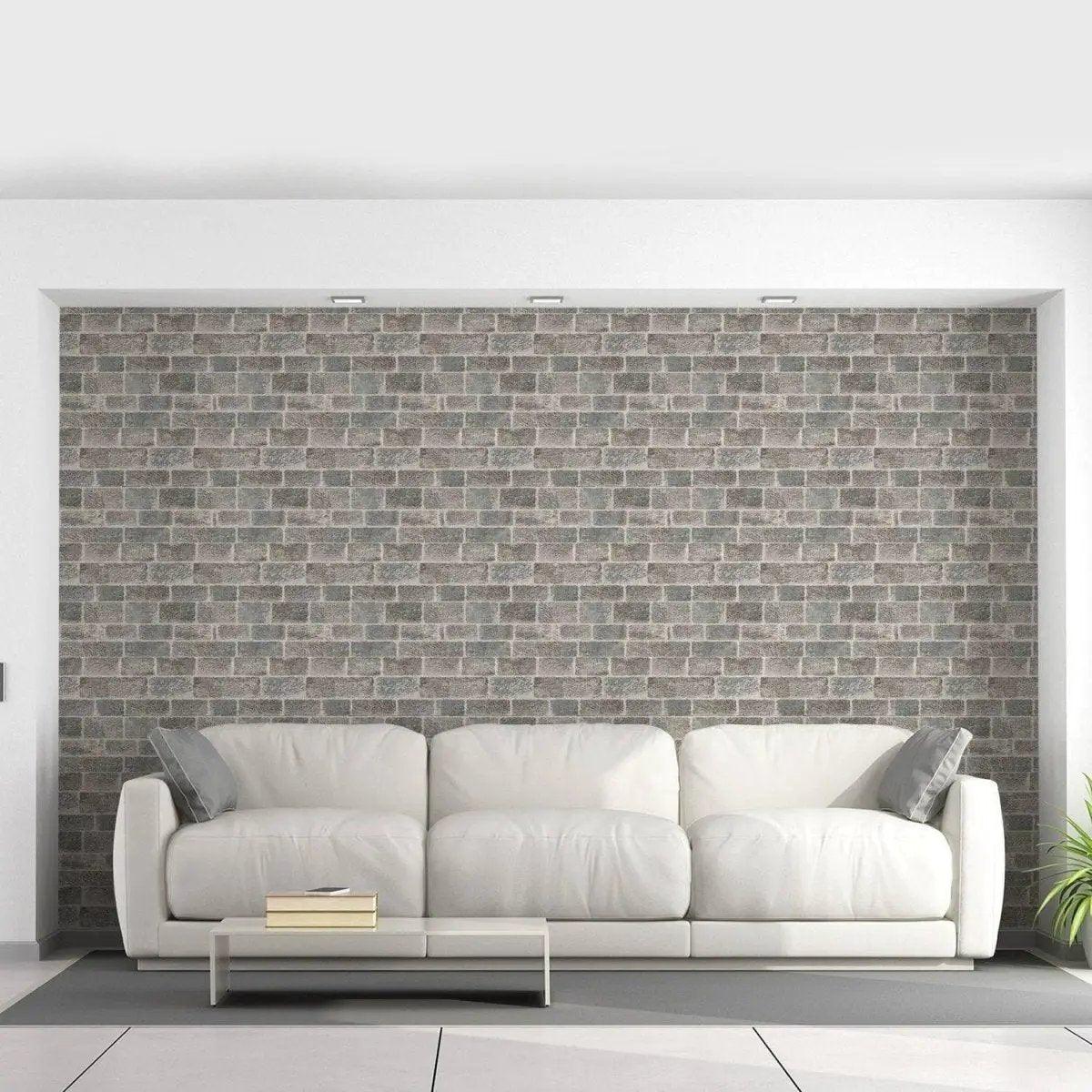 Flat printed stone-effect vinyl wall mural in stylish living room with white couch and modern decor