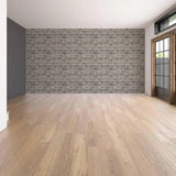 Interior of a modern room featuring a peel-and-stick printed stone-effect vinyl wall mural.