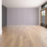 Spacious living room showcasing peel and stick 3D stone wall transformation kit wallpaper on a feature wall.