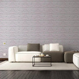 Stylish living room featuring peel and stick 3D stone wall wallpaper with modern furniture and neutral colors.