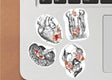 Anatomy-themed vinyl decals featuring heart, brain, and human figures with floral designs on a laptop surface.