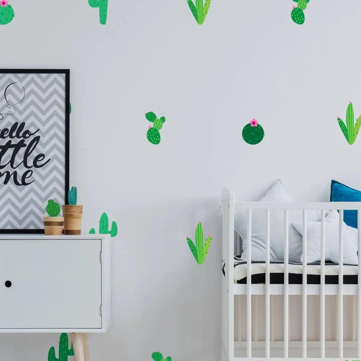 Cactus Oasis vinyl wall decals in a nursery, vibrant stickers on white walls, modern decor with cribs and artwork.