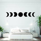 Moon phase wall hanging decor in a modern bedroom, featuring celestial lunar artwork sticker.