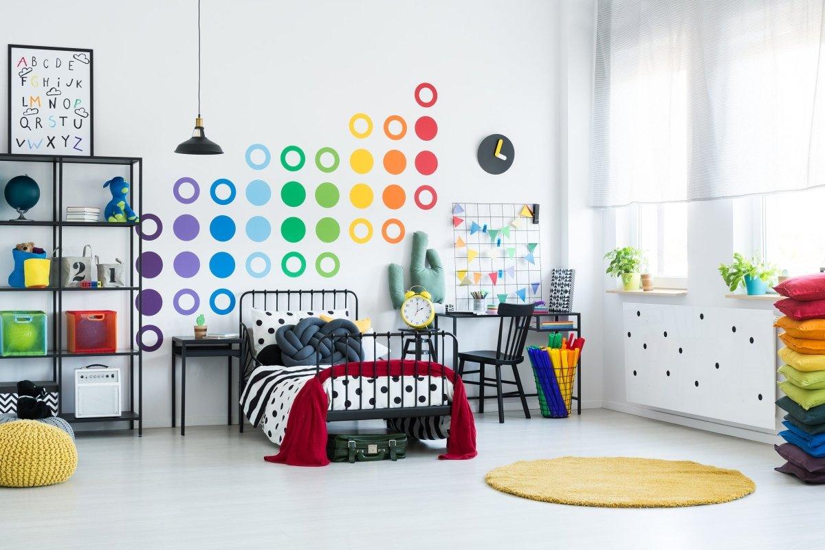 Colorful circle wall decals in a cheerful bedroom, adding vibrant decor and whimsy to the space.