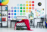 Colorful circle wall decals in a modern bedroom, adding whimsy and vibrant decor to the space.