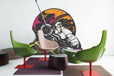 Cosmic Chimp decorative wall decal featuring an astronaut monkey design in a vibrant interior setting.