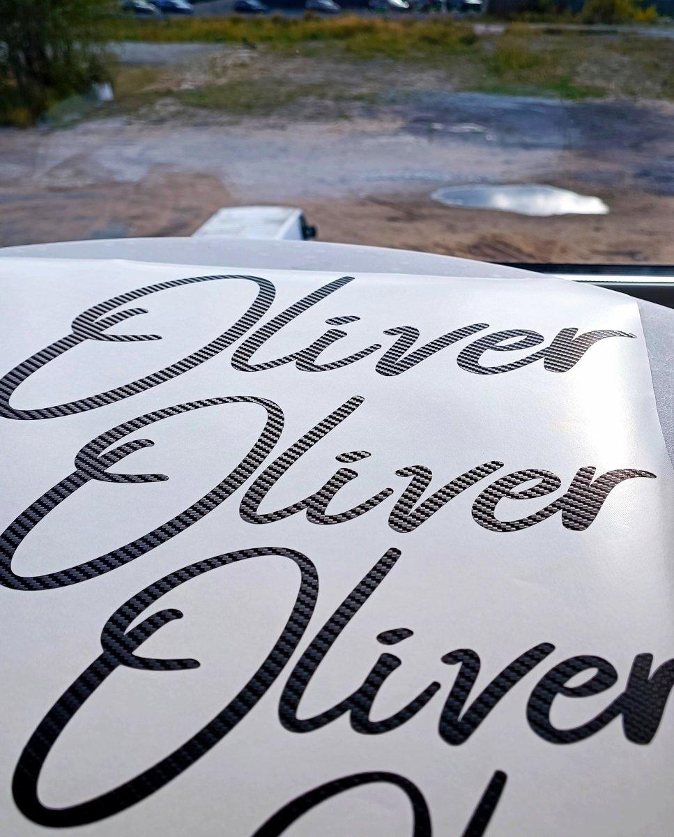 Personalized carbon fiber vinyl name decals featuring the name Oliver, showcasing stylish custom monogram design.