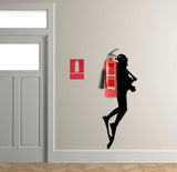 Scuba diver wall sticker with a fire extinguisher on a wall, adding a unique touch to home decor.