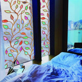 Elegant etched leaf design window film providing privacy and style in a modern bedroom setting.