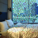 Etched leaf design privacy glass window film in a stylish bedroom with natural light filtering through.