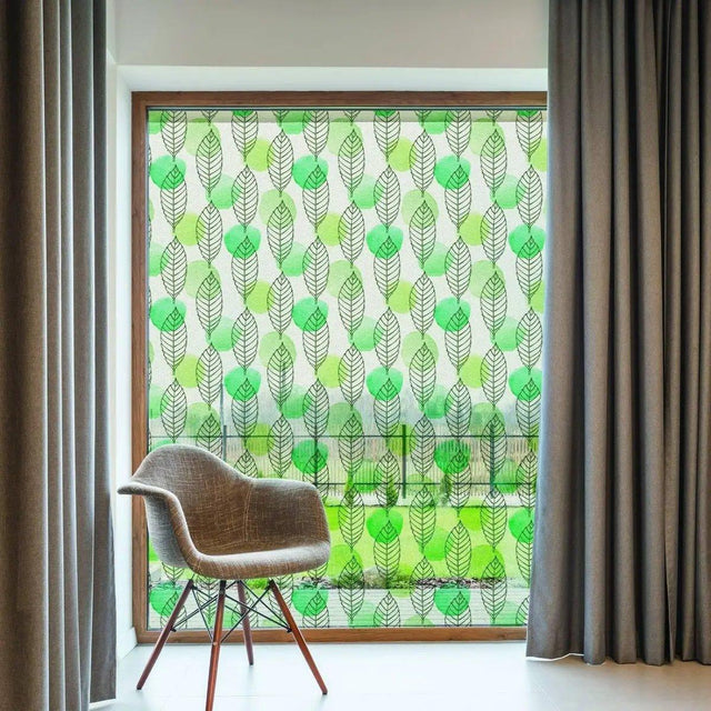 Etched glass film with stylish leaf design on window, providing privacy and allowing natural light in.