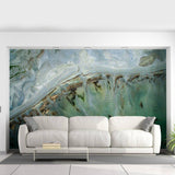 Chic marble design self-adhesive wallpaper accent wall behind a modern white sofa, showcasing stunning stone effect.