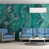 Living room featuring luxurious self-adhesive marble wallpaper, blue couches, and modern decor for a stylish ambiance.