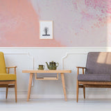 Elegant marble self-adhesive wallpaper with a pink swirl pattern in a cozy living room setup.