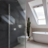 Frosted vinyl window decal enhancing privacy in a stylish bathroom with modern decor and natural light.