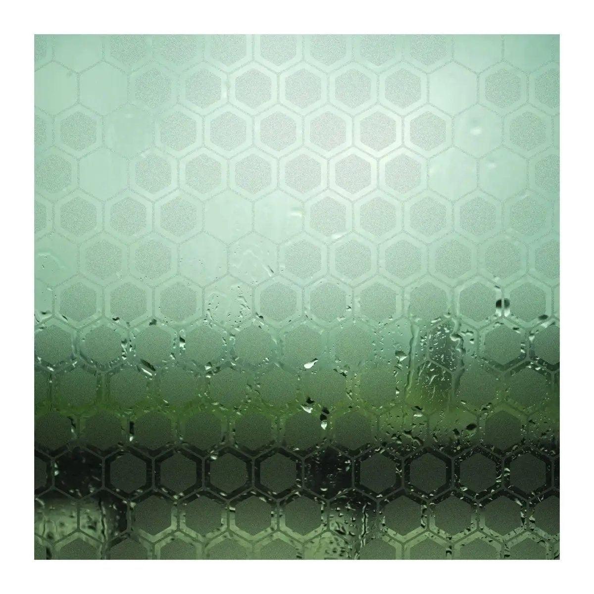 Frosted hexagon patterned window film creating privacy while allowing light in.