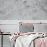 Elegant bedroom featuring stone texture self-stick wallpaper with gray and pink bedding decor.