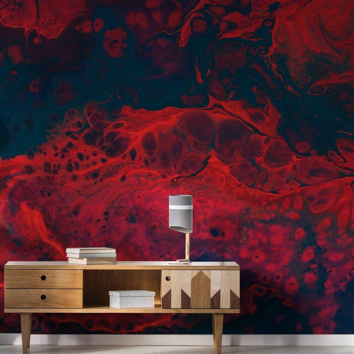 Chic red and blue abstract wall covering with a wooden console table, enhancing modern home decor.