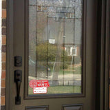 Emergency pet alert cling sticker displayed on a front door, indicating pets inside for safety during emergencies.