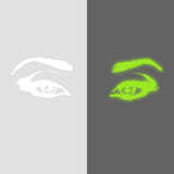 Glowing luminescent eye vinyl wall decal in bright green and white on contrasting backgrounds.