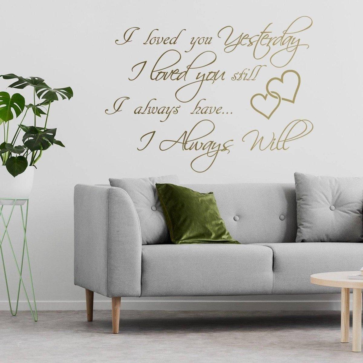 Love Forever Wall Sticker on a stylish living room wall above a modern couch with greenery.