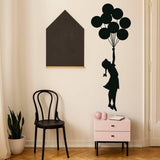 Ethereal Dreams Balloon Girl wall sticker in a cozy room.