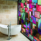 Frosted privacy window film in a colorful geometric design, enhancing elegance and privacy in a modern bathroom.