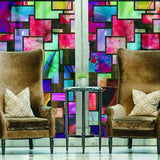 Elegant frosted privacy window film featuring colorful abstract design, enhancing glass panels in a stylish living space.