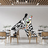 Unique DJ giraffe vinyl decal with colorful headphones on a stylish wall in a modern dining space.