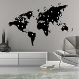 Stylish black world map vinyl sticker wall decal in modern living room design.