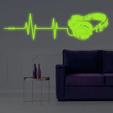Luminous vinyl wall decal of headphones and sound waves.