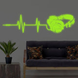 Luminous vinyl wall decal featuring headphone and soundwave design.