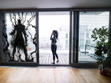 Frosted vampire silhouette window decal adding gothic elegance to a chic modern space.