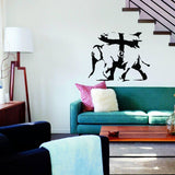 Majestic elephant graffiti style vinyl sticker on a living room wall above a green couch, vibrant wall art decor.