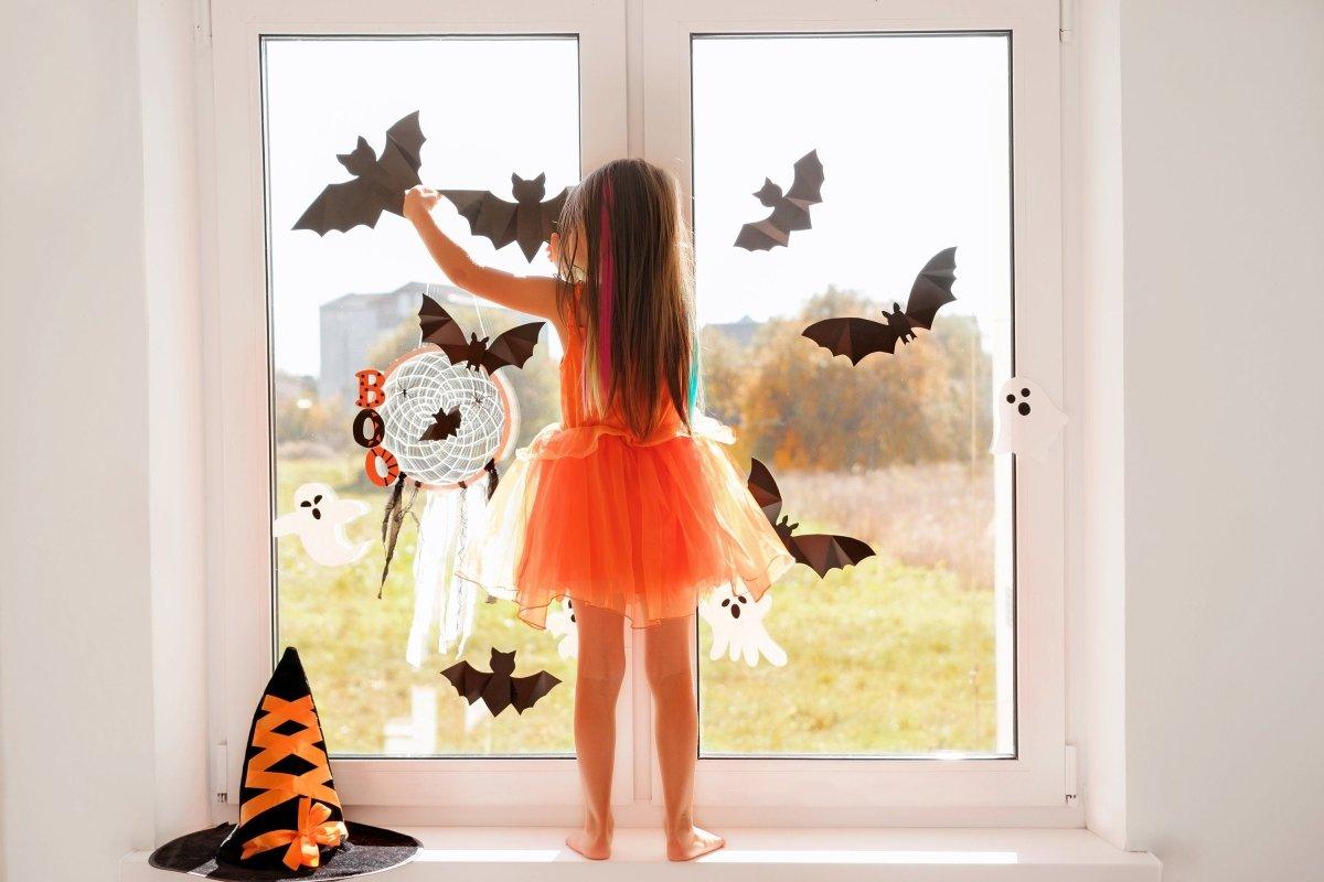 Bat-shaped vinyl decals displayed on a window.