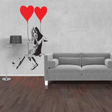 Girl silhouette wall sticker with red heart balloons in a modern living room.