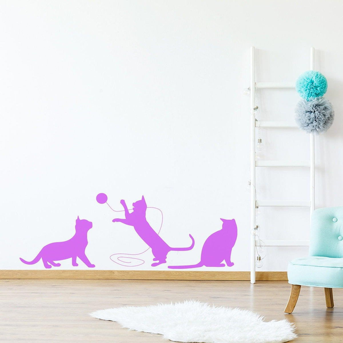 Cute purple cat wall decal with playful cats and a ball.