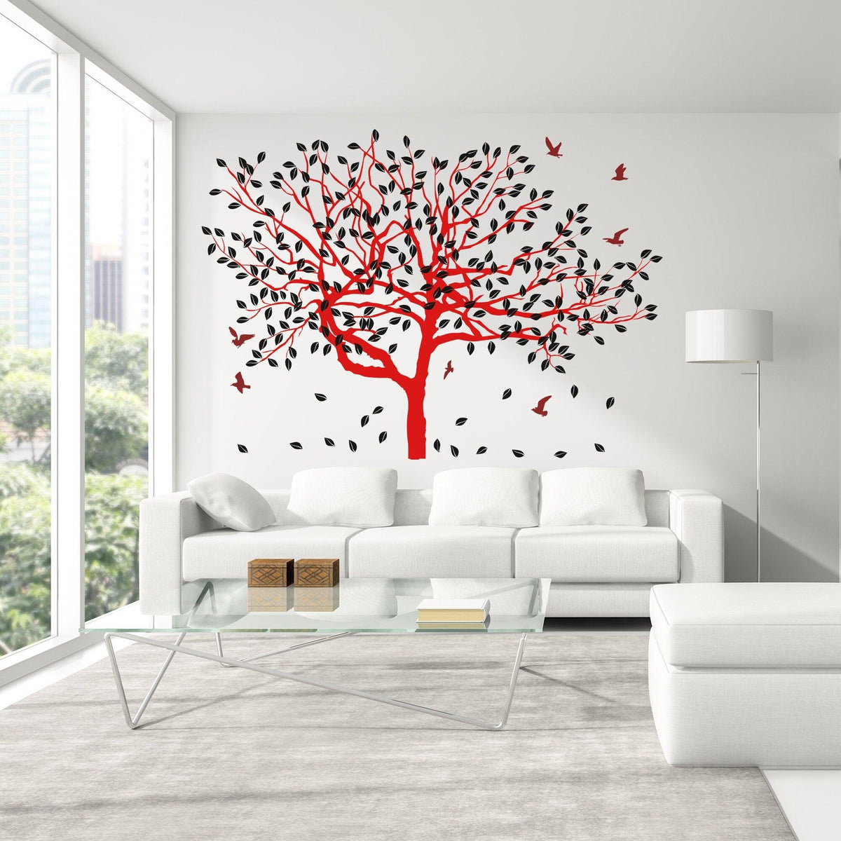 Red tree wall decal with black leaves and birds in modern living room.