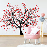 Birch tree wall decal with red leaves in a nursery, enhancing decor with a nature-inspired design.