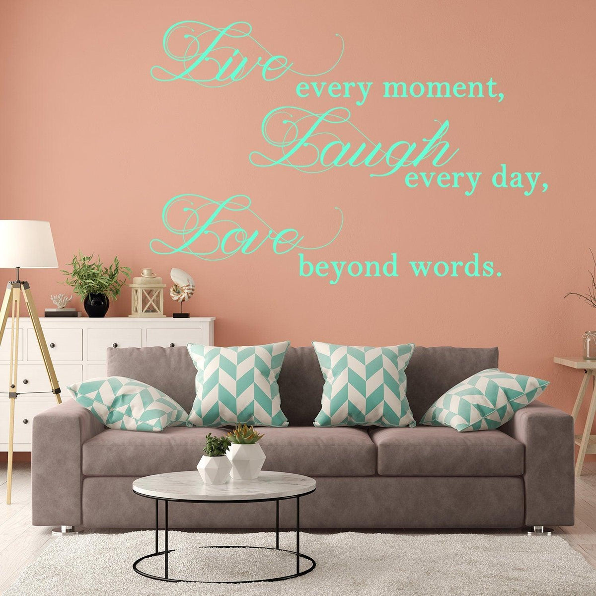 Inspirational Live Laugh Love wall art sticker in a stylish living room with teal decor.