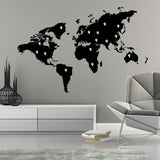 World Map Vinyl Sticker wall art in black on a grey wall above modern furniture.