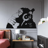 Thinking monkey wall sticker with headphones in a modern bedroom.