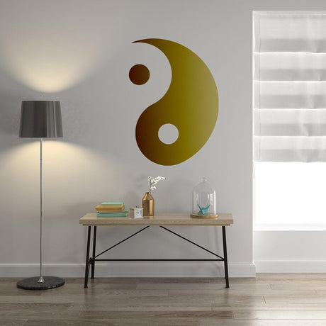 Yang Yin wall sticker vinyl decal in gold on a smooth wall.