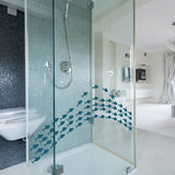 Colorful fish vinyl wall sticker in a modern shower, adding ocean-themed decor to the bathroom.