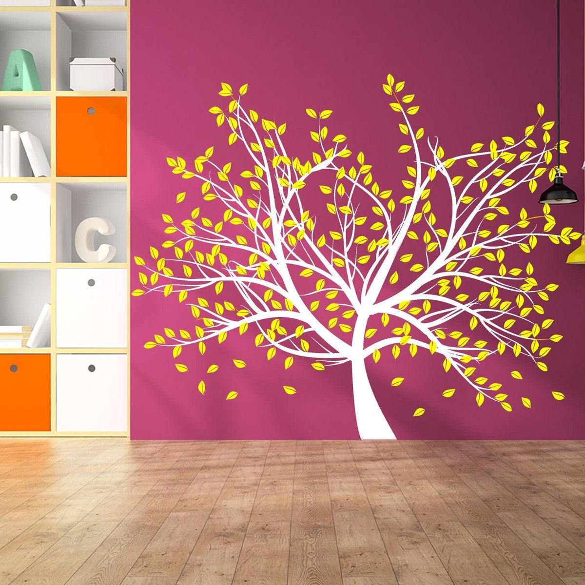 Bright tree wall decal with yellow leaves on a purple wall, creating a vibrant nursery decor.