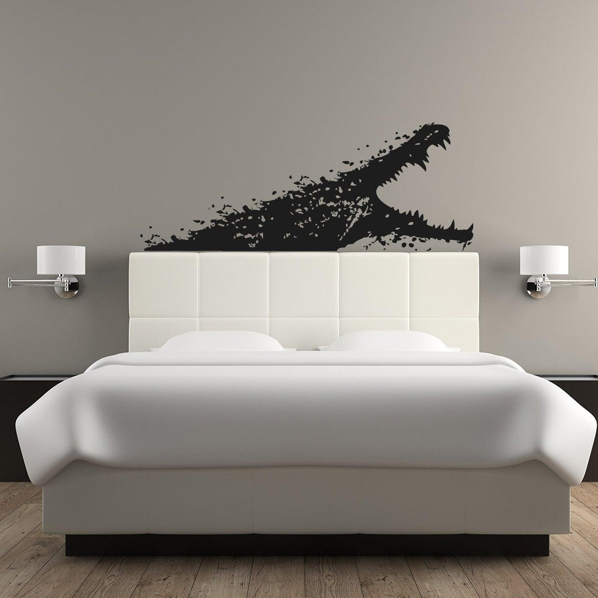 Black alligator wall sticker above a white bed, adding a unique touch to bedroom decor.