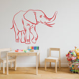 Elephant wall decal sticker in red, adding charm to a child's playroom with colorful toys and furniture.