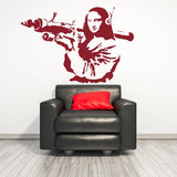 Mona Lisa wall sticker above a black couch.