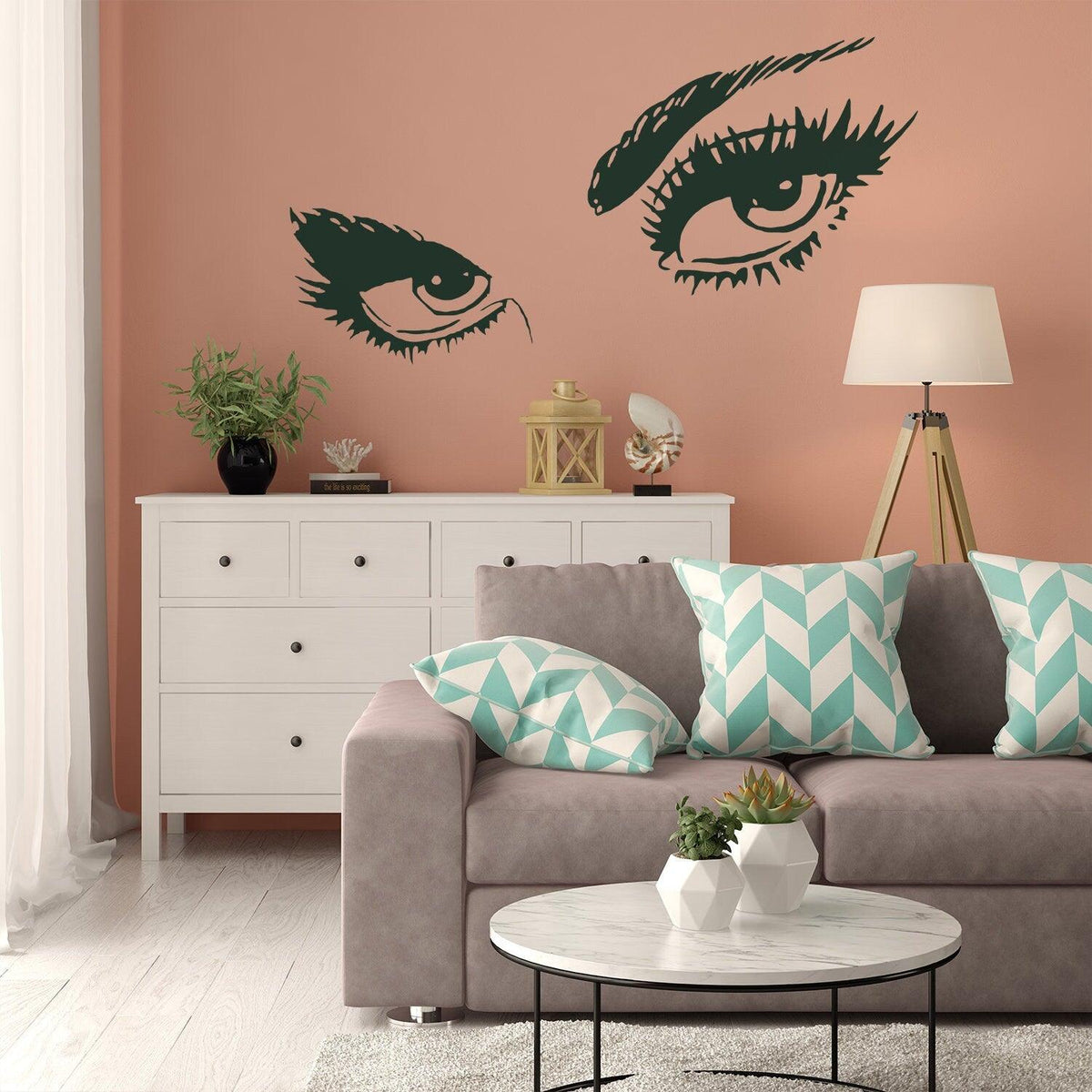 Stylish Woman Eye Vinyl Wall Sticker showcased in a modern living room with decor and furniture.
